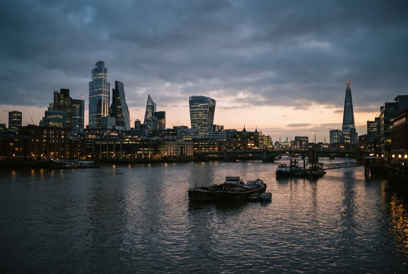 The City of London skyline across the River Thames at twilight